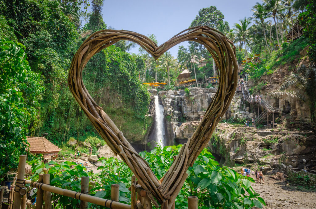 Beautiful Tegenungan waterfall in tropical rainforest in Bali, Indonesia